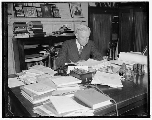 ...] Texas senator. Washington, D.C., Nov. 4. The veteran U.S. Senator from Texas, Morris Sheppard is busily engaged these days preparing for the opening of the special session Congress on November 15. This picture was made at Senator's office today. 11/4/37