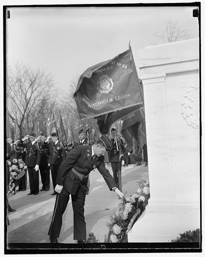 Legion head places wreath at unknown soldier's tomb. Washington, D.C., Nov. 11. Daniel J. Doherty, National Commander of the American Legion, placing a wreath on the tomb of America's Unknown Soldier at Arlington today to observe the 19th Anniversary of Armistice Day, 11/11/37