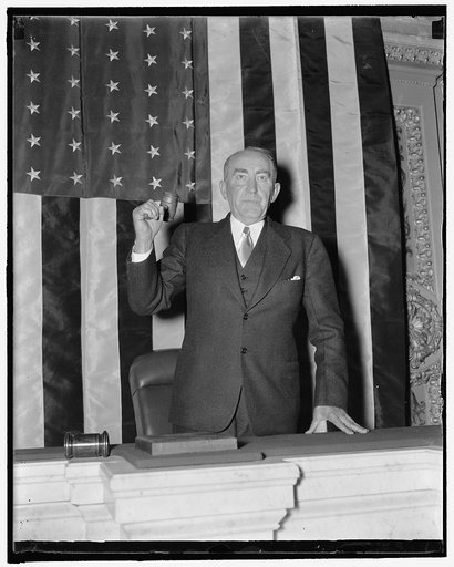Ready for the gong. Washington, D.C., Nov. 12. Speaker of the House William B. Bankhead was in fine form today as he practiced banging his gavel for the benefit of news photographers preparatory to the opening of the special session November 15. 11/12/37