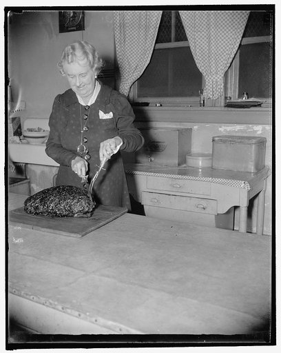 Mrs. Bristol cuts ham