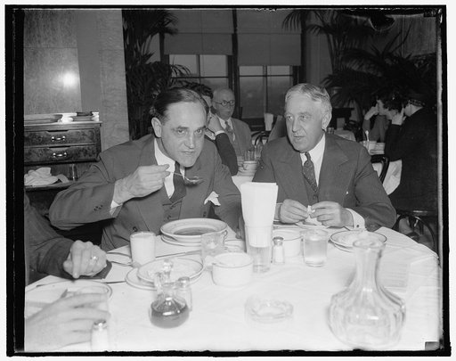 Gentlemen from Indiana. Washington, D.C., Nov. 15. Democratic Senator Sherman Minton of Indiana, takes time out at the opening of the special session to enjoy a bit of lunch in the Capitol restaurant. 11/15/37