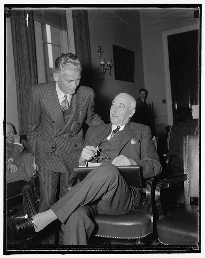Appear before house rivers and harbors committee. Washington, D.C., Nov. 23. Stuart Chase, (left) New York economist, and L.C. Sabine, of Cleveland, Vice-President of the Lake Carriers Association, were the first witnesses called today as the House Rivers and Harbors Committee began hearings on a bi