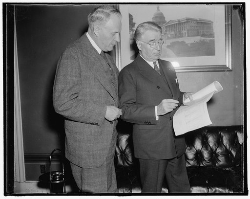 Discuss proposed bill to place transoceanic air travel under maritime commission. Washington, D.C., Nov. 26. Senator Royal S. Copeland (right) of New York, Chairman of the Senate Commerce Committee discusses with Senator Frederick Steiwer of Oregon, also a member of the committee, a bill he (Copelan