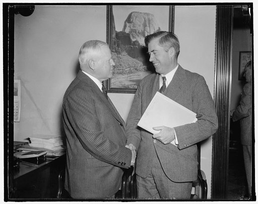 Secretary of Agriculture and governor of Wyoming before house rivers and harbors comm. Washington, D.C., Nov. 30. Secretary of Agriculture Henry A. Wallace, (right) and Governor Leslie Miller, of Wyoming, meet just before they appeared before the House Rivers and Harbors Committee. Wallace proposed 