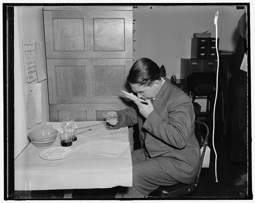 Correct way to bake turkey. H.E. McClure, of the Bureau Husbandry, tests the turkey meat for odor
