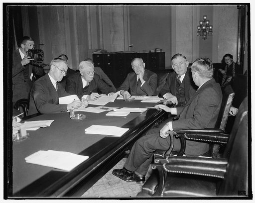 Agriculture secretary gives views on housing to senate committee. Washington, D.C., Dec. 3. Members of the Senate Banking and Currency Committee hear Secretary of Agriculture detail the steps he is taking to bring farmers within the scope of the New Housing Program proposed by President Roosevelt. I