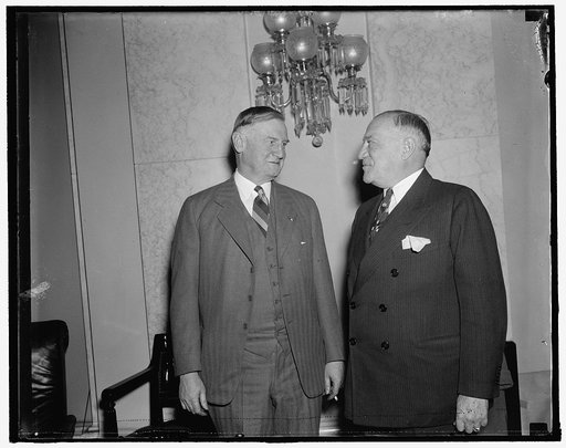 Head of Sears-Roebuck approves Roosevelt housing program. Washington, D.C., Dec. 6. Robert E. Wood, (left) President of Sears- Roebuck Co., today told the Senate Banking and Currency Committee that the proposed New Housing Program "provides for the first time the mechanics to allow a man in the low 