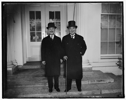 Pay respects to the president. Washington, D.C., Dec. 10. Othoiko Matsukata, left, classmate of President Roosevelt while at Harvard introduces his brother, Kojiro Matsukata, a Former Yale man to the President today. They are shown after leaving the White House after paying respects