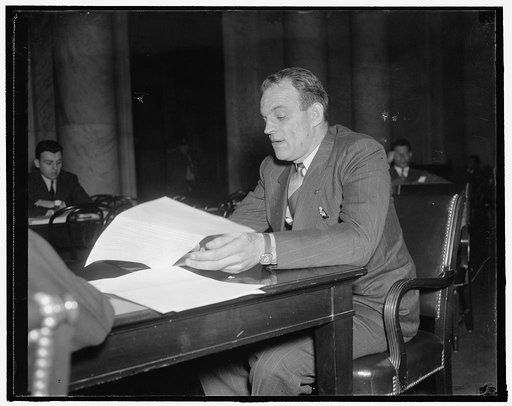 President of Maritime union appears before senate committee. Washington, D.C., Dec. 14. Joseph Curran, President of the National Maritime Union. Photographed while appearing before a senate committee on Maritime affairs, while Curran testified that, "compulsory" use of mediation should be delayed un