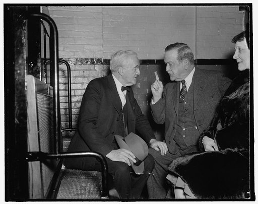 Senate veterans discuss farm bill. Washington, D.C., Dec. 15. No doubt these senate veterans, Senator George W. Norris (left) of Nebraska, and Senator Ellison "Cotton Ed" Smith of South Carolina, were discussing the Farm Bill as they rode the subway from the Senate office building to the Capitol. Se