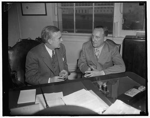 Newsreel cameraman describes sinking of Panay to Assistant Navy head. Washington, D.C., Dec. 31. Norman Alley, intrepid newsreel cameraman who was aboard the U.S.S. Panay shooting pictures while the gunboat was being bombed by the Japanese in the Yangtze River, December 12, describing his experience