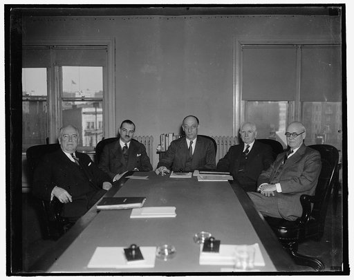 Federal Trade Commission. Washington, D.C., Jan. 3. The first picture of the Federal Trade Commission with the newly elected Chairman Garland S. Ferguson, presiding. Left to right: Charles H. March, Robert E. Freer, Chairman Garland S. Ferguson, Ewin L. Davis, and William A. Ayres, 1/3/38