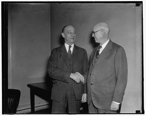 FTC chairmanship changes hands. Washington, D.C., Jan. 3. Commissioner William A. Ayres (right) today relinquished the Chairmanship of the Federal Trade Commission to Commissioner Garland S. Ferguson, who was elected last week. The FTC Chairmanship rotates yearly, 1/3/38