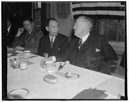 Discuss far east war situation. Washington, D.C., Jan. 8. Col. Montchen Thomas Tchou, China's first housing expert, discusses the far east situation with Rep. Sam McReynolds, Chairman of the House Foreign Affairs Committee, at a luncheon at the National Press Club. The luncheon was given for Col. Tc