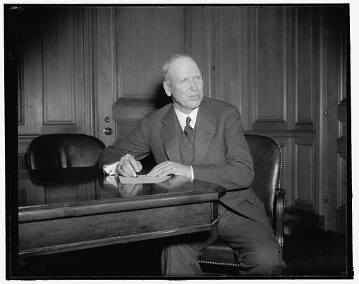 New Assistant Secretary of Labor. Washington, D.C., Jan. 20. Charles V. McLaughlin, new Assistant Secretary of Labor, photographed at his desk today shortly after he took the oath of office. McLaughlin, who is Senior Vice President of the Brotherhood of Firemen and Enginemen, succeeds Edward F. McGr