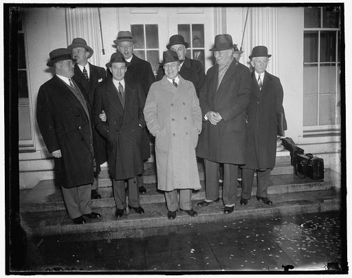 Auto manufacturers confer with Roosevelt. Washington, D.C., Jan. 21. Big shots of the auto industry shown leaving the White House after conferring with President Roosevelt, the group approved the President's credit selling recommendations and forecast as spring upturn in motor sales which should imp