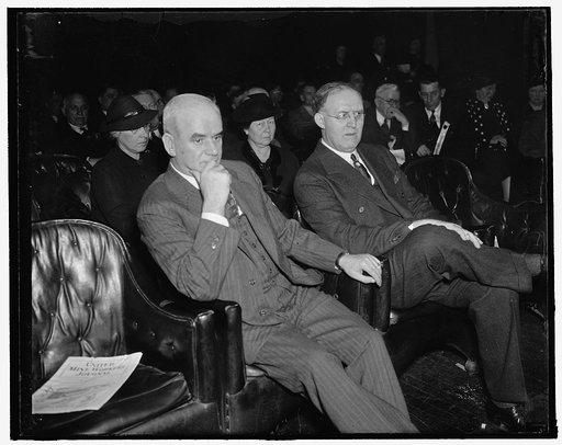 Wife of CIO Head attends Mine Workers Convention. Washington, D.C., Jan. 25. Mrs. John L. Lewis, wife of the CIO Head and President of the United Mine Workers, listens attentively as her husband delivers the opening speech at the 35th annual convention of the UMWA today. Lewis declared that labor wi