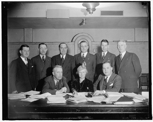 National Veteran's Employment Committee of the American Legion. Seated, L-R: Jack Crowley of Vermont, Nat'l Chairman of Vet. Emp. Comm.; Mrs. Ada Mucklestone of Ill., National Chairman of the American Legion Auxiliary; Paul H. Griffith, (D.C.), National Director of Re-Employment. Standing, L-R: [...