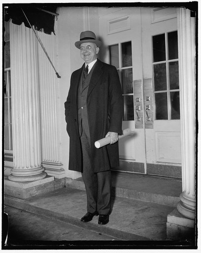 Stanley Reed receives commission. Washington, D.C., Jan. 27. Stanley Reed, photographed as he left the Executive offices of the White House, where President Roosevelt today personally handed t o him his commission to the Supreme Court, 1/27/38