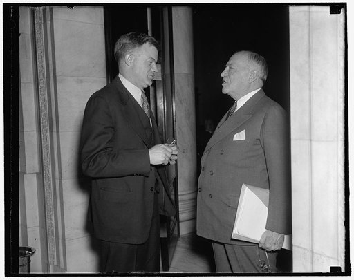 Author and administrator of Wagner Labor Act go into a huddle. Washington, D.C., Jan. 27. Immediately following the blast put on the National Labor Relations Board today by Senator Burke, Democrat of Nebraska, before the Senate Judiciary Subcommittee, Senator Robert E. Wagner (right), author of the 