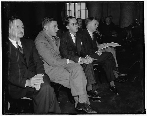Members hear Nebraska Senator flat National Labor Relations Board. Washington, D.C., Jan. 27. Members of the National Labor Relations Board listen intently as Senator Burke, Democrat of Nebraska, today charged before the Senate Judiciary Subcommittee that enforcement of the Wagner Labor Act by the N