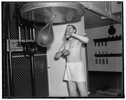 A congressman's day. 5:30 P.M. An expert athlete, Rep. Thomas takes a daily workout in the house gym to keep in physical shape. Sports are the only hobby of the congressman, 12/31/37