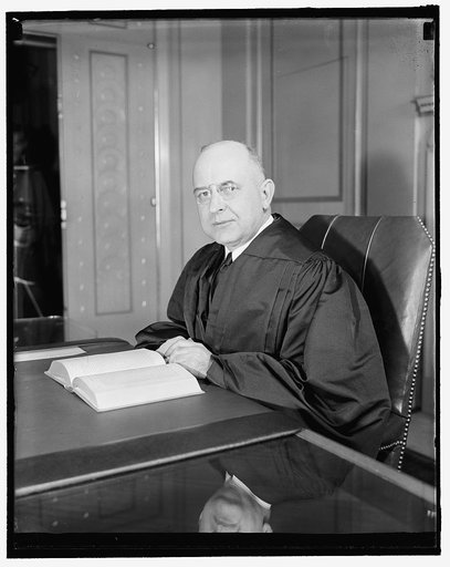 New Supreme Court Justice in robes. Washington, D.C., Jan. 29. The new Associate Justice of the United States Supreme Court, Stanley Reed, pictured in his robes for the first time since his confirmation