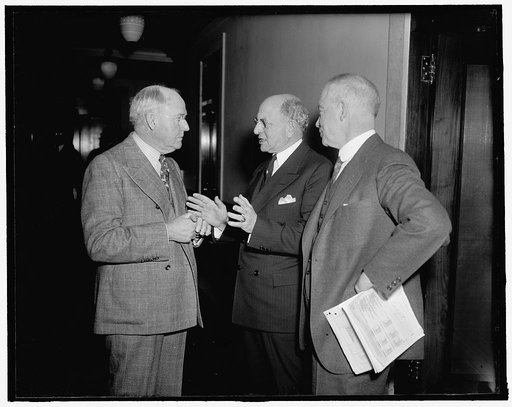 At U.S. Chamber of Commerce meeting. Washington, D.C., Jan. 28. Silas H. Strawn, of Chicago; James W. Spangler, (center) of Seattle, Wash.; and Eliot Wadsworth, of Boston; snapped as they attended the annual meeting of the Board of Directors of the U.S. Chamber of Commerce today, 1/28/38