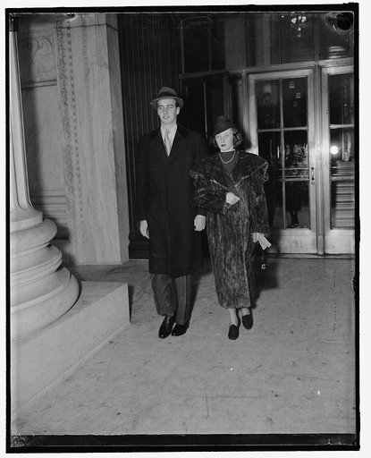Roosevelt and fiancee visit Supreme Court. Washington, D.C., Jan. 31. John Roosevelt and his fiancee Miss Anne Clark, shown as they left the Supreme Court today after seeing Stanley Reed, former Solicitor General take his place on the bench, 1/31/38