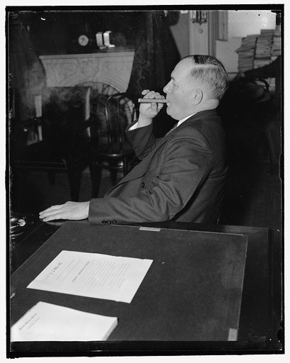 Nebraska Senator. Washington, D.C., Feb. 1. Senator Edward R. Burke of Nebraska, who recently introduced bill for a senate investigation of the National Labor Relations Board, listens in at the Senate hearing on the nomination of Robert H. Jackson to be Solicitor General, 2/1/38