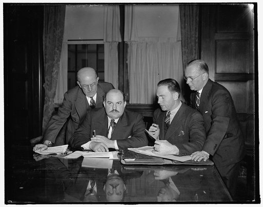 O.L. Roach, Leslie E. Saunders, W.C. T[...]sley, and Howard D. North at E[...] Roper conference room during conference, 2/4/38