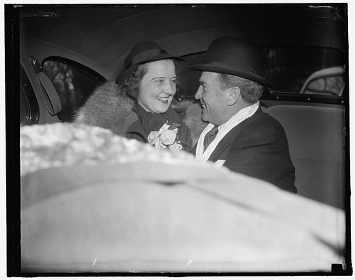 New Jersey senator takes bride. Fairfax Courthouse, Va. Feb. 9. United States Senator William H. Smathers of New Jersey, with his bride the former Mary James Foley of Berryville, Va., leaving the old historic courthouse here today following the wedding ceremony. The ceremony was performed by Rev. R.