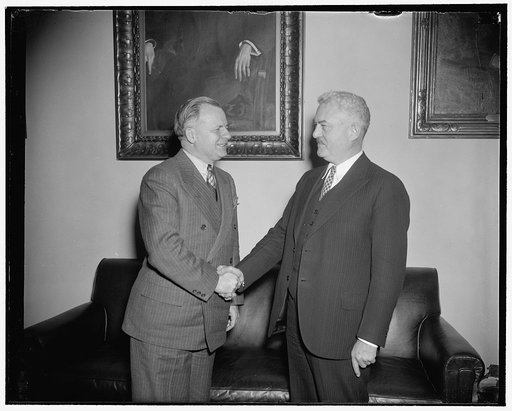 J.F.T. O'Connor, Comptroller of the Treasury, former Pres. of the California State Society, shaking hands with congressman Frank Buck, new President of the Society
