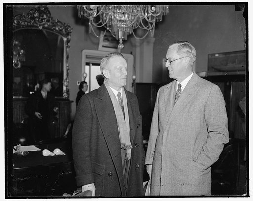 Retiring and probable new head of Maritime Commission. Washington, D.C., Feb. 16. Joseph P. Kennedy, (right) who is resigning as Head of the U.S. Maritime Commission to accept the post of U.S. Ambassador to Great Britain, is shown with his probable successor Rear Admiral Emory S. Land. They were sna