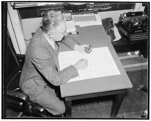 How a bill become a law. After discussion and debate on the merits and defects of the bill as presented or amended, a vote is taken either by "aye & nay", tellers, or tally. This picture shows Hans Jurgensen, tally clerk of the house recording the results of a tally vote