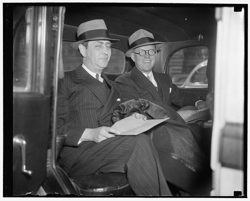New U.S. envoy to Great Britain and aide. Washington, D.C., Feb. 18. Joseph P. Kennedy, who was sworn in today as American Ambassador to Great Britain, is shown with the first aide he has chosen. Harold [...] Hinton, formerly Washington Correspondent for the New York Times. It is presumed Hinton wil