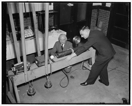 Bureau of Standards designs mechanical batter to determine liveliness of baseballs. Washington, D.C., Feb. 21. Using a newly designed apparatus, the U.S. Bureau of Standards today began experiments to determine the relative home-run qualities of American, National and International baseballs. In con