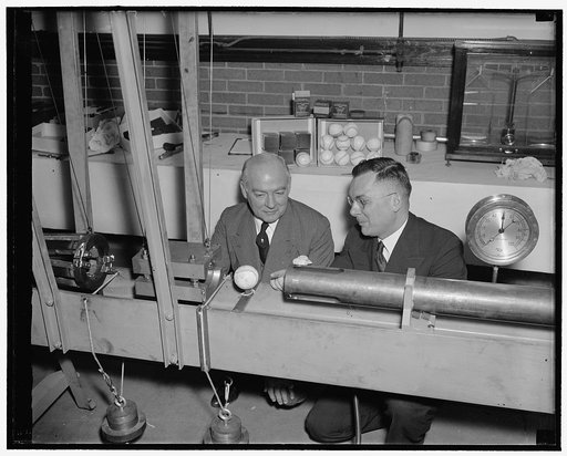 U.S. testing liveliness of baseballs. Washington, D.C., Feb. 21. Experiments to test the liveliness of American, National and International League baseballs began at the National Bureau of Standards today. Edward B. Eynon, (left) Secretary of the Washington Baseball Club, and Dr. Hugh L. Dryden, Chi
