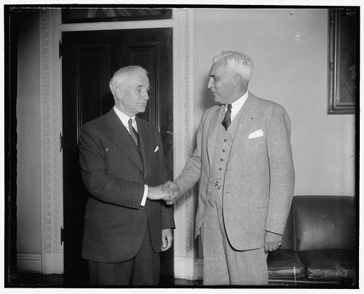 State Secretary greets High Commissioner Paul McNutt. Washington, D.C., Feb. 23. Making his round of official calls shortly after his arrival in the capital today, Paul V. McNutt, High Commissioner to the Philippines, is greeted at the State Department by Secretary of State Cordell Hull. Informed of
