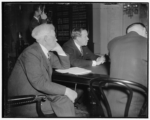 Interested listeners. Washington, D.C., Feb. 24. Senator John G. Townsend (left), of Delaware, and Senator Robert Bulkley, of Ohio, listen intently today to Witnesses before the Senate Banking and Currency Subcommittee on the Bulkley Bill providing for a $6,000,000,000 system of superhighways in the