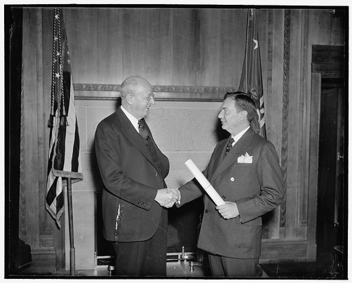 Congratulations. Washington, D.C., March 5. Attorney General Homer S. Cummings congratulating Robert H. Jackson today shortly after he was sworn in as United States Solicitor General, 3/5/38