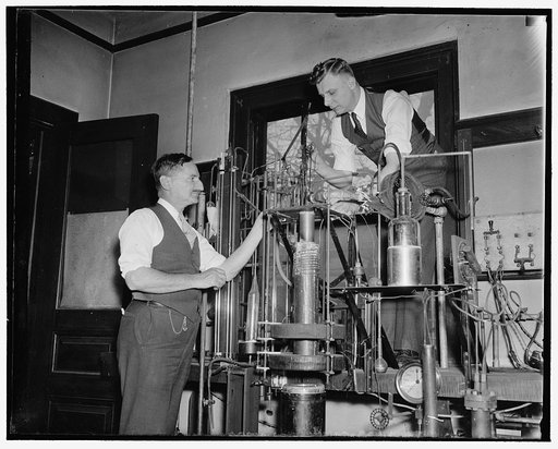 Government experts discover "perpetual" electrical current. Washington, D.C., March 10. Dr. F.B. Silsbee (left) and Dr. F.G. Brickwedge, of the Bureau of Standards, have just concluded experiments which have proved that an electric current, cut off from its original source, will flow eternally round