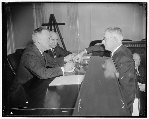 Senate Committee questions Undersecretary of Agriculture. Washington, D.C., March 10. Sen. James F. Byrnes (left), Chairman, and Senator Lynn J. Frazier, member of the Senate Unemployment and relief Committee, questioning M.L. Wilson, Undersecretary of Agriculture, at the Capitol today. Wilson told 