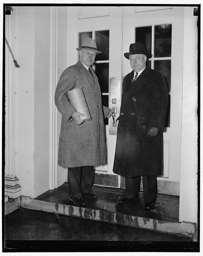 Sen. F. Ryan Duffy (with cheese) and George L. Mooney, Secty, Nat'l Cheese Inst., Plymouth, Wisc., present cheese to Roosevelt, 3/5/38