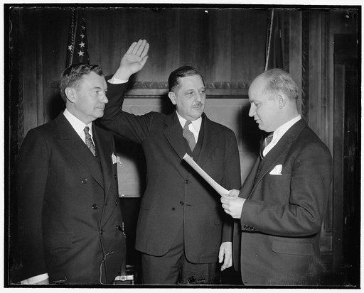 Jackson successor takes oath. Washington, D.C., March 21. Thurman Arnold, former Yale University Law Professor, was today sworn in as Assistant Attorney General in charge of anti-trust division. He succeeds Robert H. Jackson, who was appointed Solicitor General. In the photograph, left to right: Sol