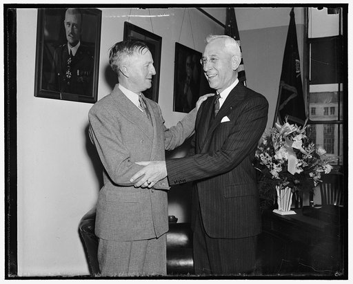 Congratulations! Washington, D.C., March 26. Mutual congratulations were exchanged today as Maj. Gen. John K. Kerry (left) became U.S. Chief of Calvary, and Maj. Gen. R.M. Danford assumed the post of Chief Field Artillery. The officers are personal friends of long standing, 3/26/38