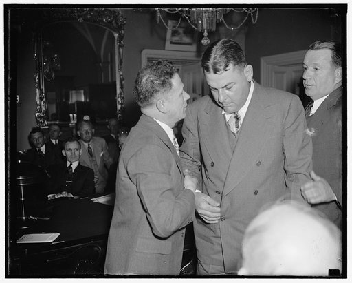 Last minute huddle. Washington, D.C., March 28. Senator Allen J. Ellender (left) whispers into the ear of Governor Richard W. Lesche of Louisiana today just before the Governor [...] before the Senate Commerce Subcommittee to urge passage of the Overton Amendment for construction of the Organza Floo