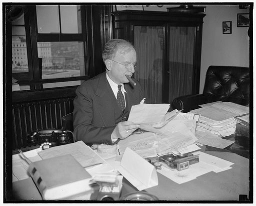 Reads protest against Government Reorganization Bill. Washington, D.C., March 28. Montana's Senator Burton K. Wheeler found his desk stacked high with telegraphic protests against the Government Reorganization Bill when he arrived at his office in the Capitol today, 3/28/38