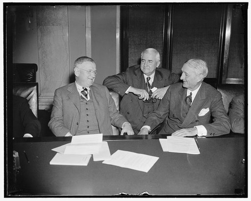 Ask expansion of RFC lending power. Washington, D.C., March 29. Secretary of Interior Harold Jones (left) and RFC Chairman Jesse Jones (center) both appeared before the Senate Banking and Currency Committee today to urge expansion of the RFC lending powers in order to remove the present limit of $20