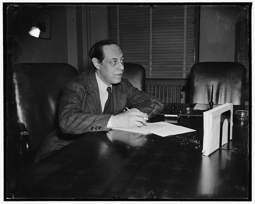 Sec. member. Washington, D.C., March 31. Jerome Frank, new member of the Securities and Exchange Commission, pictured at his desk today, 3/31/38